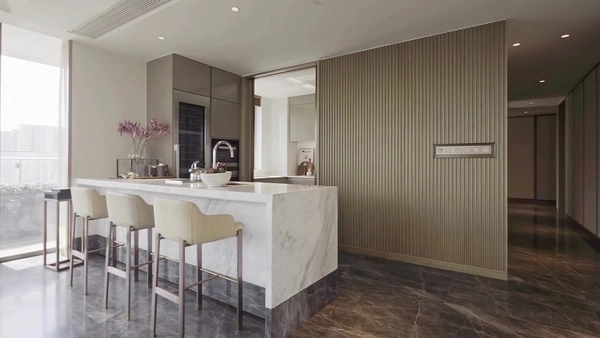 A beautiful kitchen with a light theme and granite island.