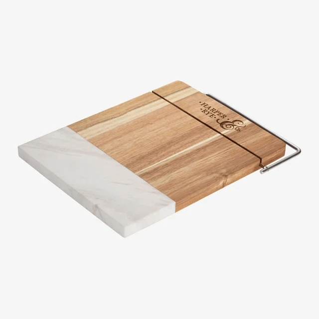 Wood and marble cheese board with stainless steel wire cutter.