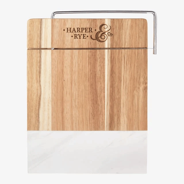 Marble and wood cheese cutter board with Harper Rye Co engraved logo.
