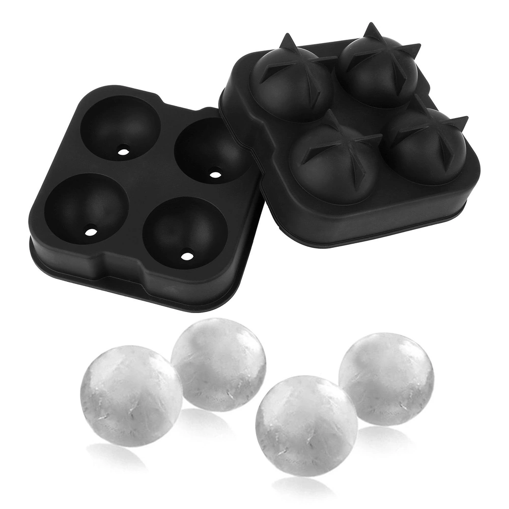Black silicone ice ball mold with four compartments, and three round ice balls.
