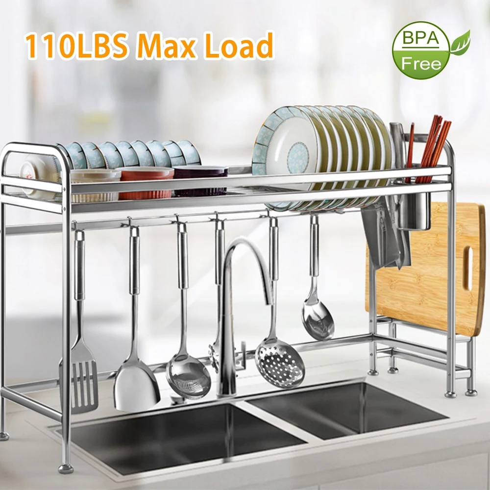 Metal dish rack over kitchen sink holding plates, utensils, and BPA-free label, with 110 lbs max load capacity.