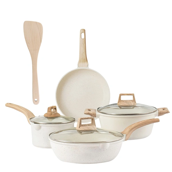 A set of beige ceramic cookware with wooden handles and matching lid, including a saucepan, skillet, frying pan, and spatula.