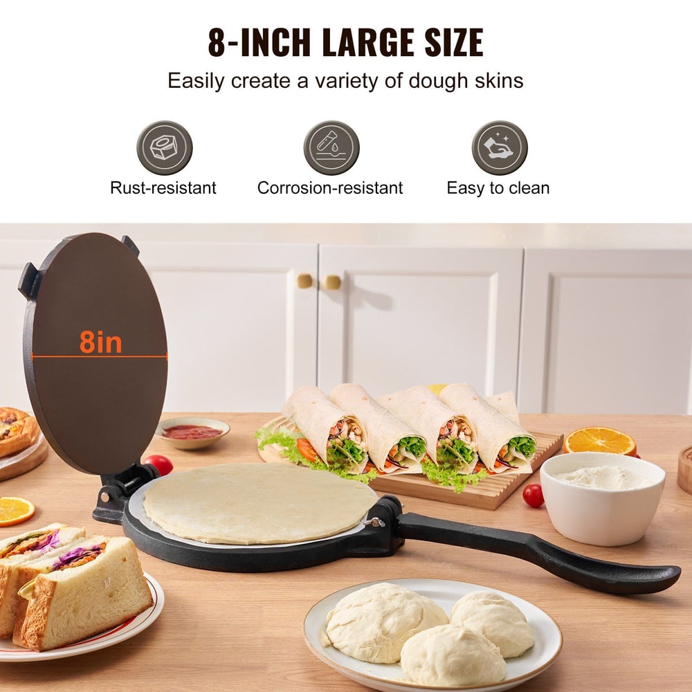 8-inch dough press with freshly made dough skins, food recipes, and dough balls on kitchen countertop.