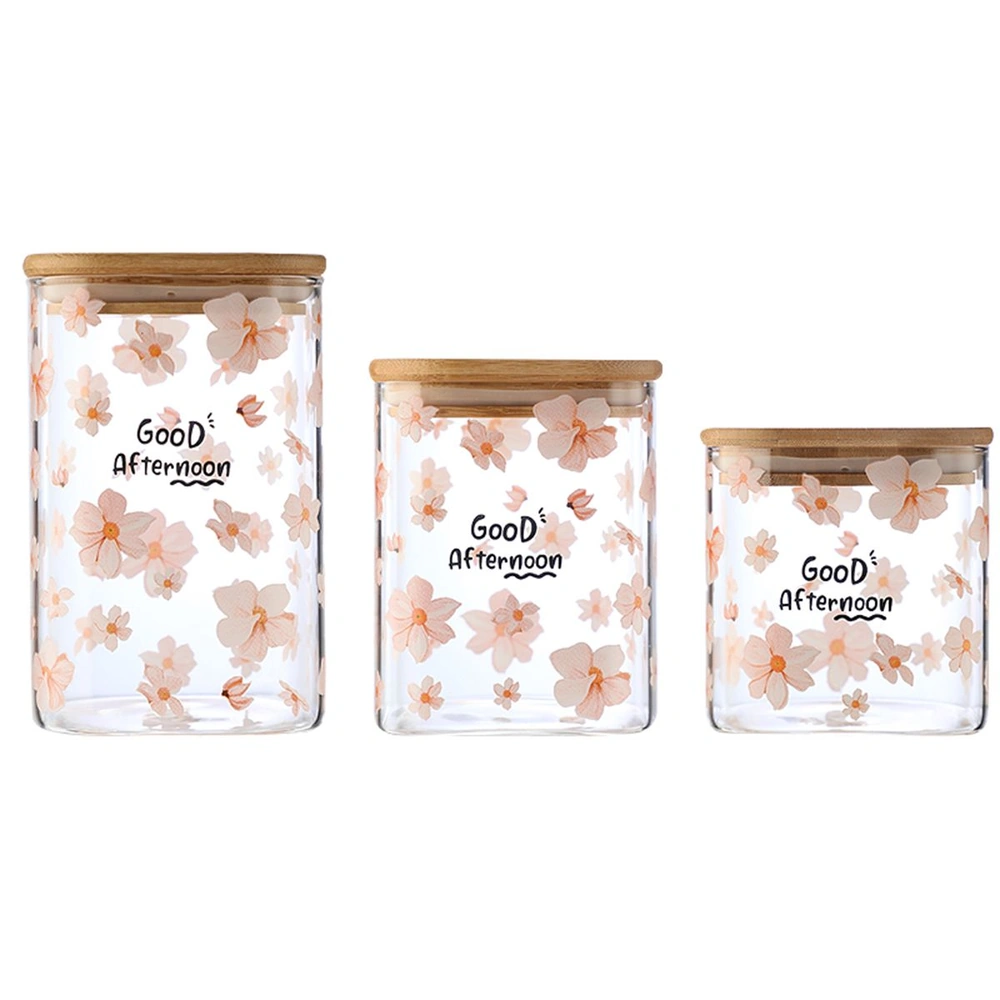 Three glass jars with wooden lids, decorated with pink flowers and labeled "Good Afternoon".