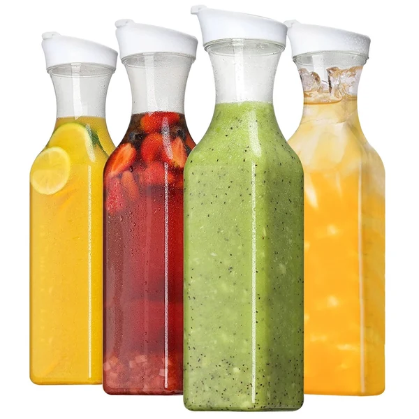 Four glass bottles filled with different colorful beverages, including lemon water, fruit punch, green smoothie, and iced tea.