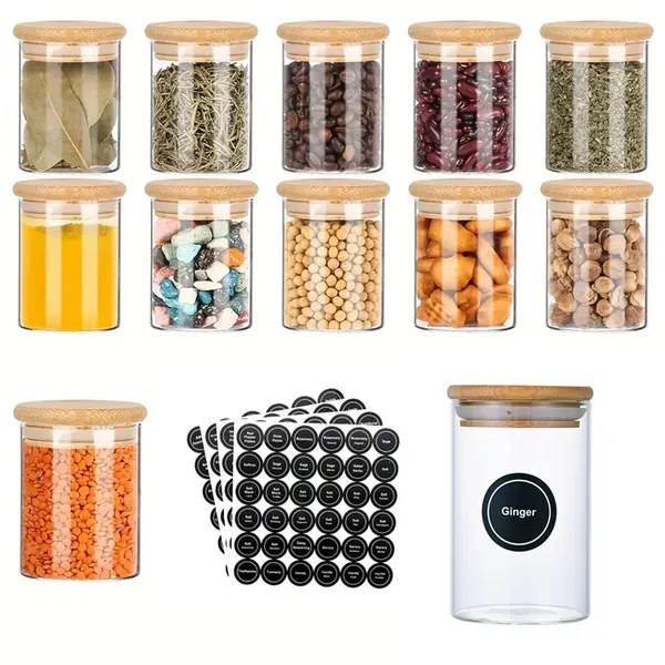 Glass spice jars with bamboo lids, assorted contents, and black labels.