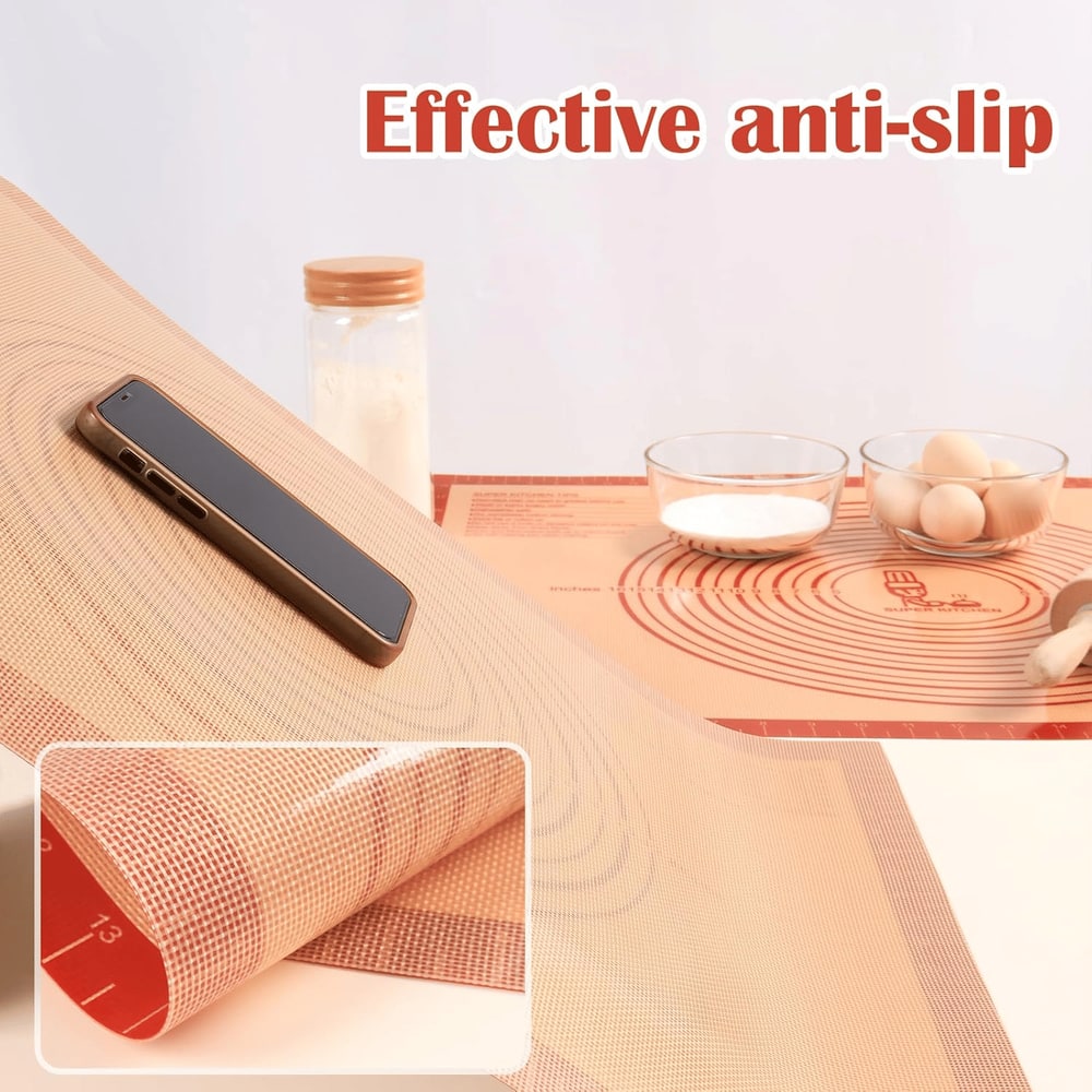 Effective anti-slip baking mat with phone, flour, eggs, and rolling pin on kitchen countertop.